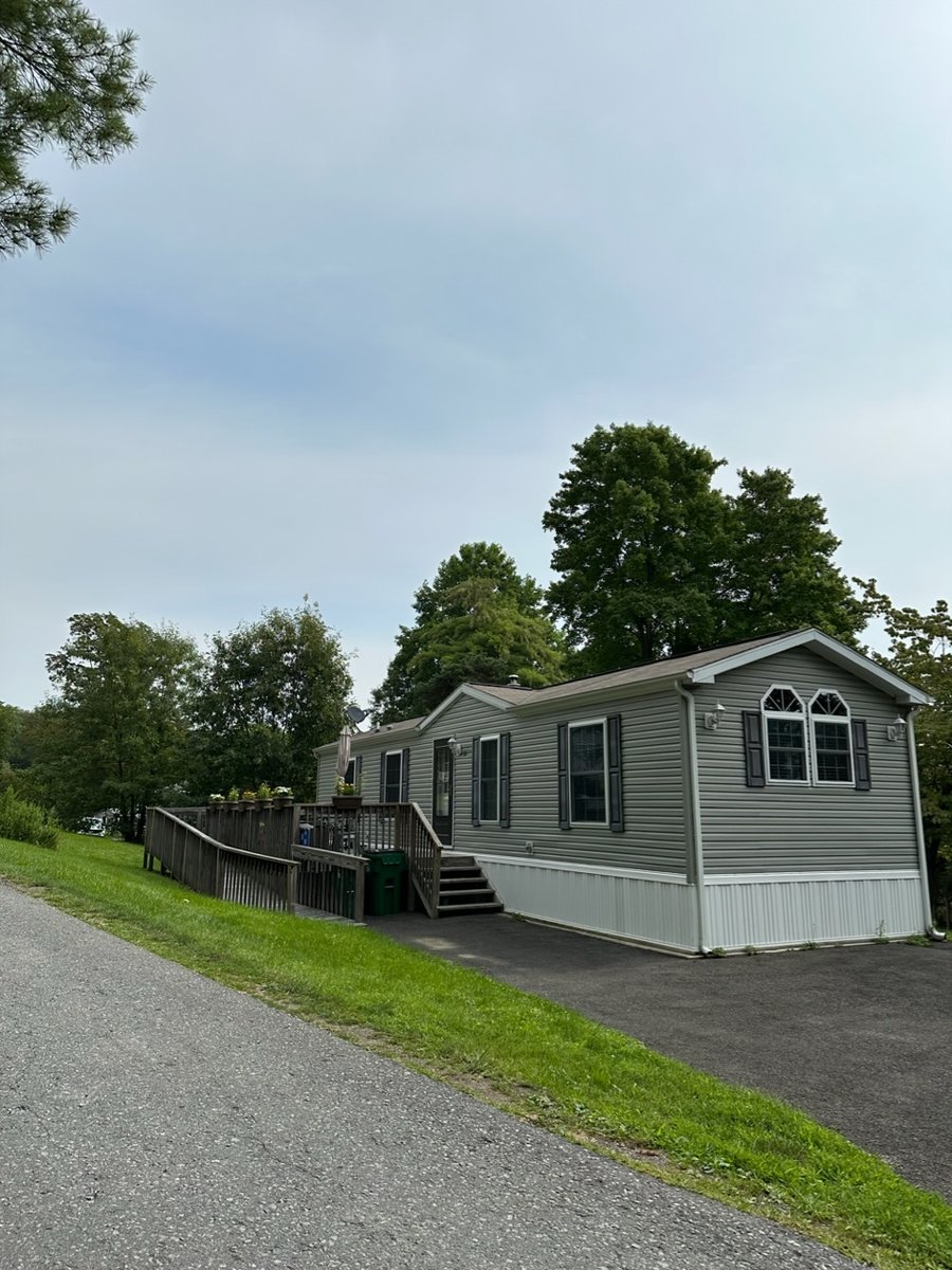 Community home with deck and gardens